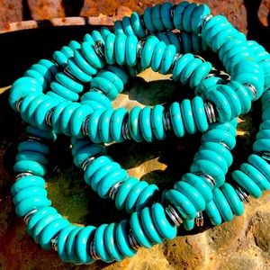 Three stretch magnesite and silver tone bracelet